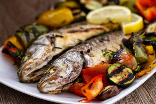 Sea bass with grilled vegetables. High quality photo.