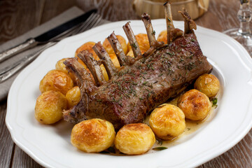 Grilled Rack of Lamb chops with potatoes on a plate