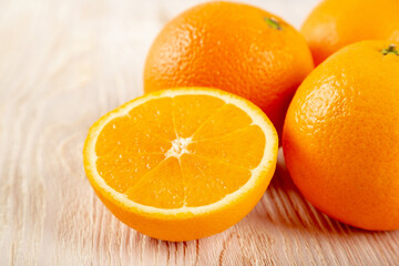 Juicy orange fruit on a wooden background
