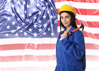 Female worker against national flag of USA