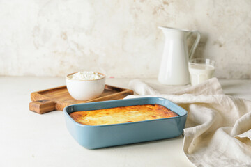 Dish with tasty cottage cheese casserole on table