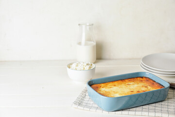 Dish with tasty cottage cheese casserole on table