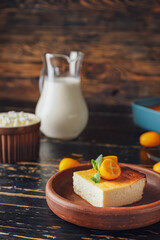 Plate with piece of cottage cheese casserole on table
