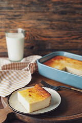 Plate with piece of cottage cheese casserole on table