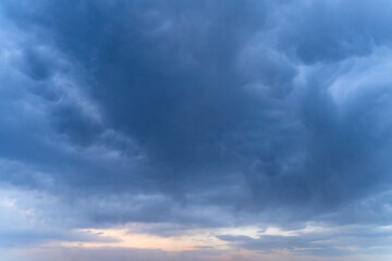 Naklejka na ściany i meble Dramatic sky. Background of dark blue clouds before thunderstorm.