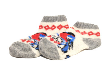 Wool socks with pattern on white background. Hand knitted warm socks