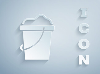 Paper cut Sand in bucket icon isolated on grey background. Plastic kid toy. Summer icon. Paper art style. Vector