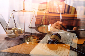 Business and lawyers discussing contract papers with brass scale on desk in office. Law, legal services, advice, justice and law concept picture with film grain effect
