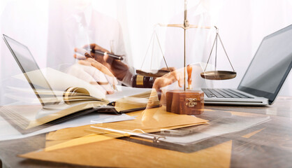 Business and lawyers discussing contract papers with brass scale on desk in office. Law, legal services, advice, justice and law concept picture with film grain effect