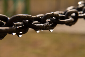 large black metal chain with raindrops on it