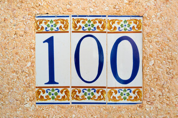 Fototapeta premium 100 (one hundred) tile numbered (door or house number)
