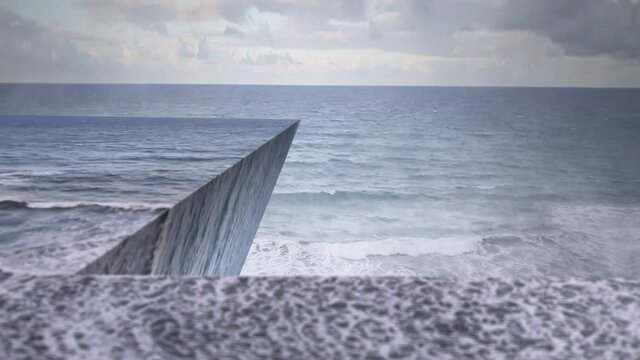 A surreal perspective-bending scene with ocean footage bent to form 3D walls and angles.