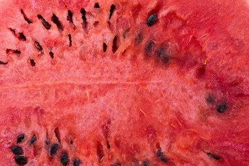 Watermelon pulp with seeds as background, texture, pattern.