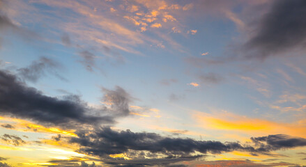 Multicolored and black clouds on a blue background sky