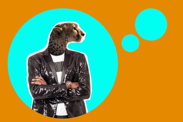 Confident man with a leopard head. Collage on theme of assertive nature of a person. Leopard symbolizes self-confidence. Self-confidence human. Guy in jacket crossed his arms. Character faces.