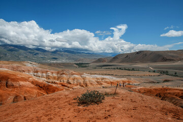 Mars on Altai, colorful deserted mountain landscape with eroded clay land of brown, red, yellow and green colors. Chagan-Uzun, Altai Republic, Russia