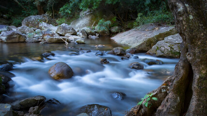 Beautiful landscape photo with waterfall in the forest and a cool breeze 