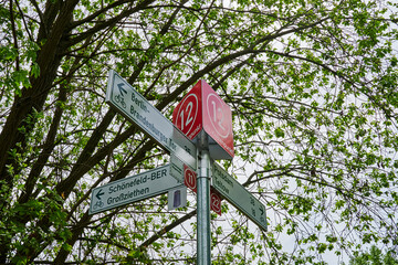 Berlin, Germany - May 15, 2021: Information sign for cyclists on the Berlin Wall Trail between Berlin and Brandenburg with various tourist destinations.