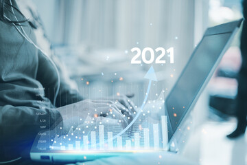 Business 2021, woman trading online via laptop. Stock market analysis concept. Successful revenue growth in the technology market
