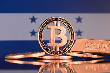Physical version of Bitcoin, gold bar and Honduras Flag.