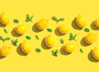 Fresh yellow lemons with mints overhead view