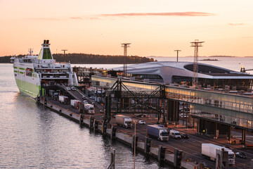 Tallink Star unloading cars and trucks in port of Helsinki at sunset, Finland - 433833351