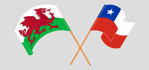 Crossed and waving flags of Wales and Chile
