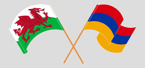 Crossed and waving flags of Wales and Armenia