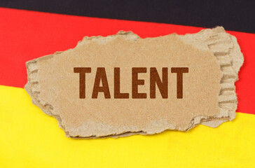 Against the background of the German flag lies cardboard with the inscription -