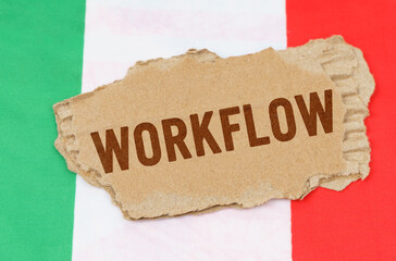 Against the background of the flag of Italy lies cardboard with the inscription - workflow
