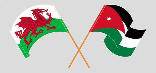 Crossed and waving flags of Wales and Jordan
