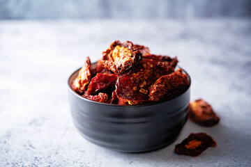 Dried tomatoes on a light background