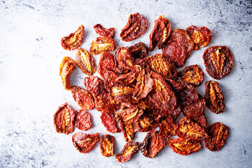 Dried tomatoes on a light background
