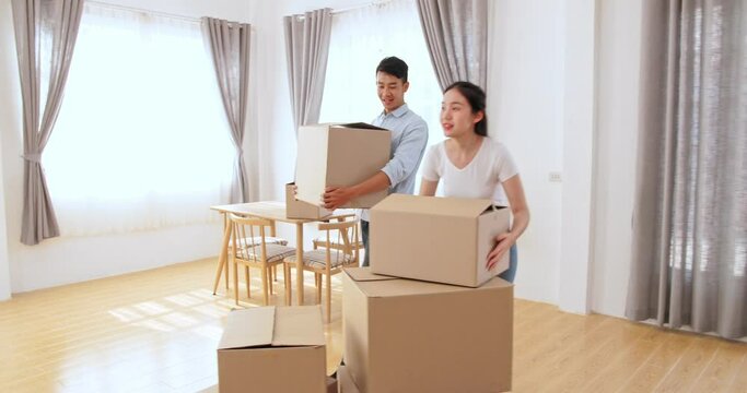 Young Couple Moving Into The New Home
