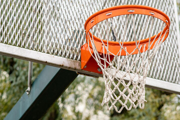 Basketball on the street. Urban style with green trees background. Healthy lifestyle. Basketball...