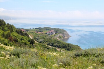 Fototapeta na wymiar View of a beautiful bay and a blooming meadow in the area of Topola village (Bulgaria)