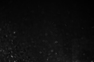 Rain On black background Glass. Background with bokeh. Black and white foto. High quality photo