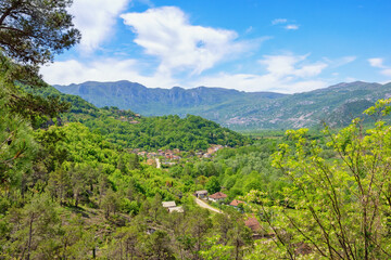 Fototapeta na wymiar Beautiful mountain landscape with small village on sunny spring day. Montenegro. National Park Lake Skadar
