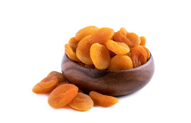 Dried apricots in wooden bowl isolated on white