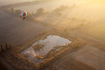 One air hot ballon above valley during sunrise