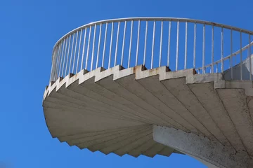 Store enrouleur Helix Bridge Spiral stairs abstract design. Round steps near the Gdanski bridge in Warsaw, Poland