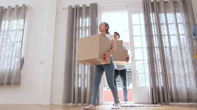 Asian Couple Moving To New House
