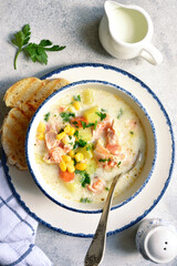 Chowder - thick potato soup with trout ( salmon ) and cream. Top view with copy space.