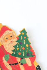 vintage Christmas card with Santa Claus holding an old school Christmas tree