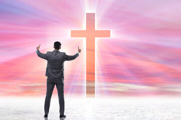 Religious concept with cross and lonely man