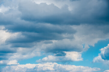 View into impressive spring sky with thick clouds as a texture or background