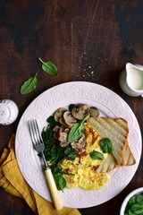 Omelet  with spinach , mushrooms and cheese . Top view with copy space.