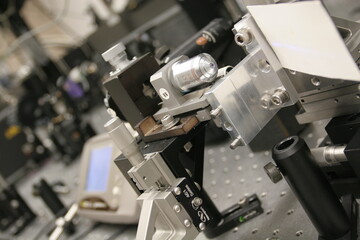 Fototapeta na wymiar Laser technology research laboratory with experimental set-up with optical devices