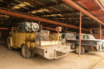 Fototapeta na wymiar Old Work Trucks, Work Trucks Under Shed