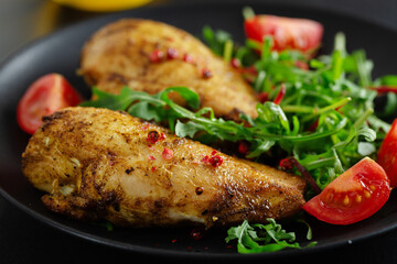 Grilled chicken breast with vegetables and salad